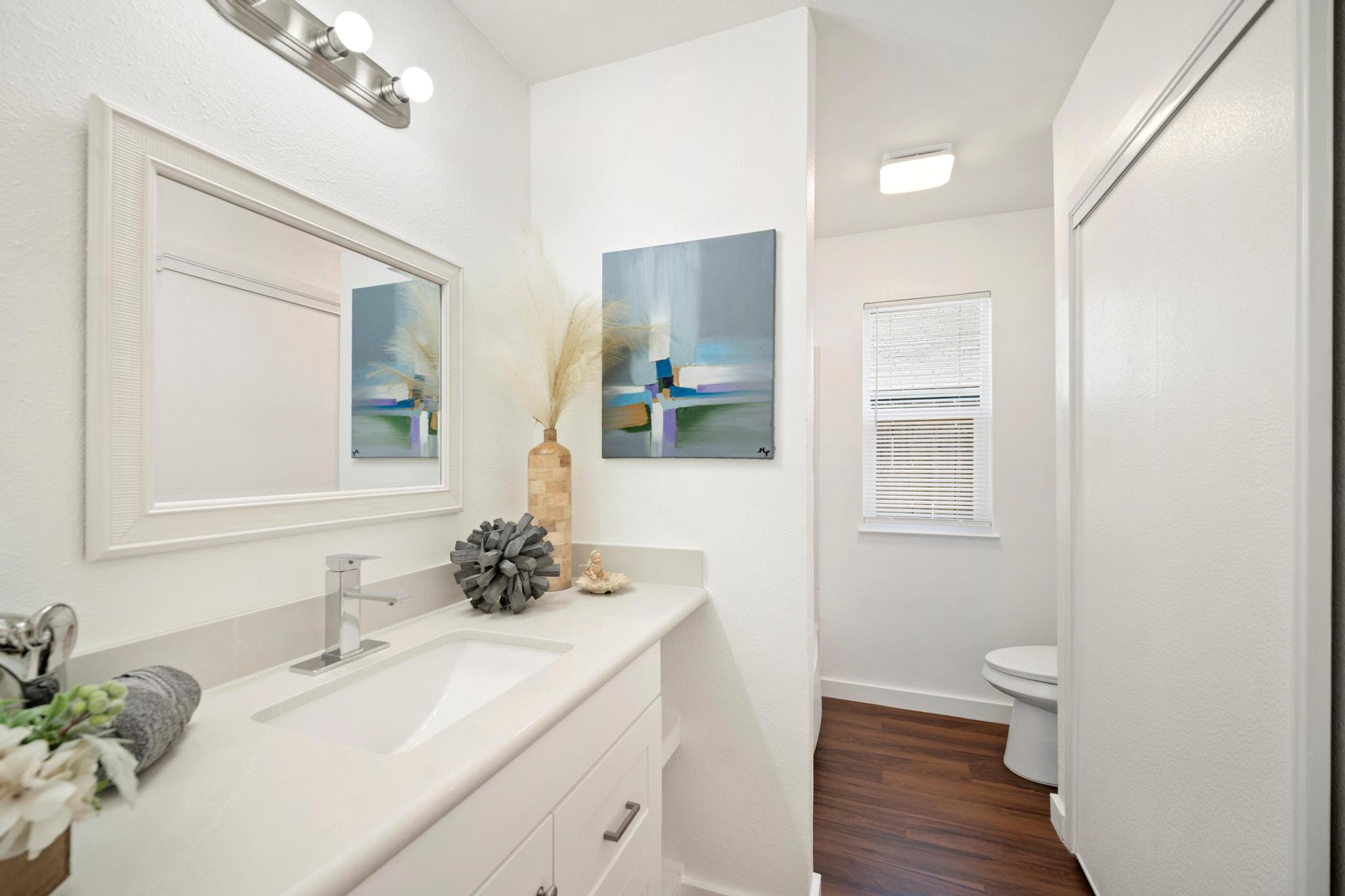 2614 Howellwood Way, Unit B Austin, TX 78748 - Photo 21 of 24 a bathroom with a sink and a mirror