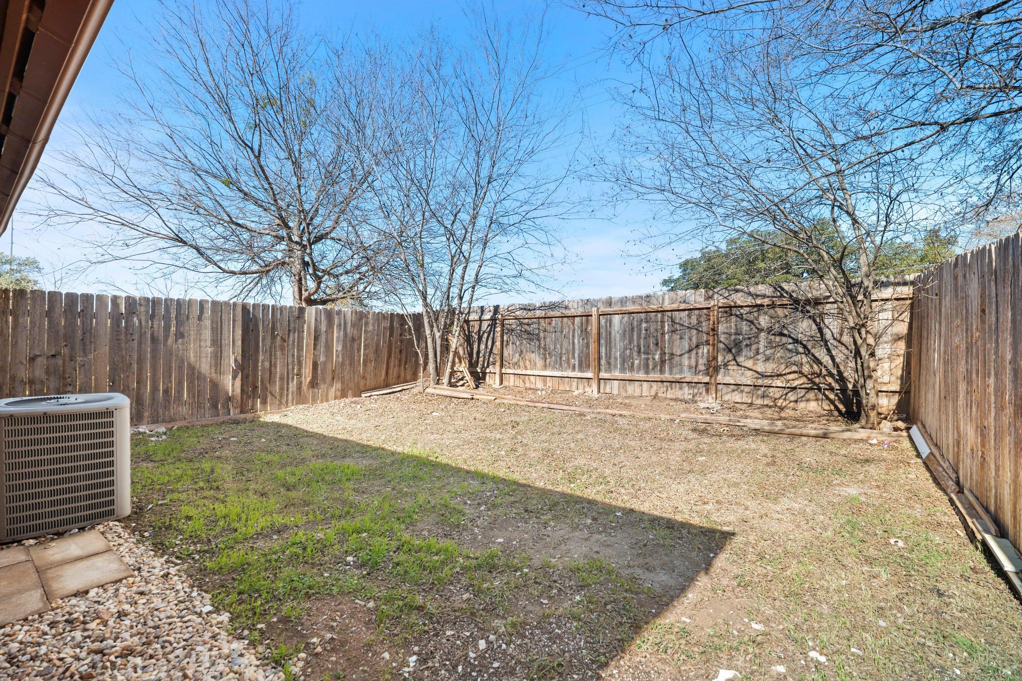 2614 Howellwood Way, Unit B Austin, TX 78748 - Photo 23 of 24 a view of backyard with wooden fence