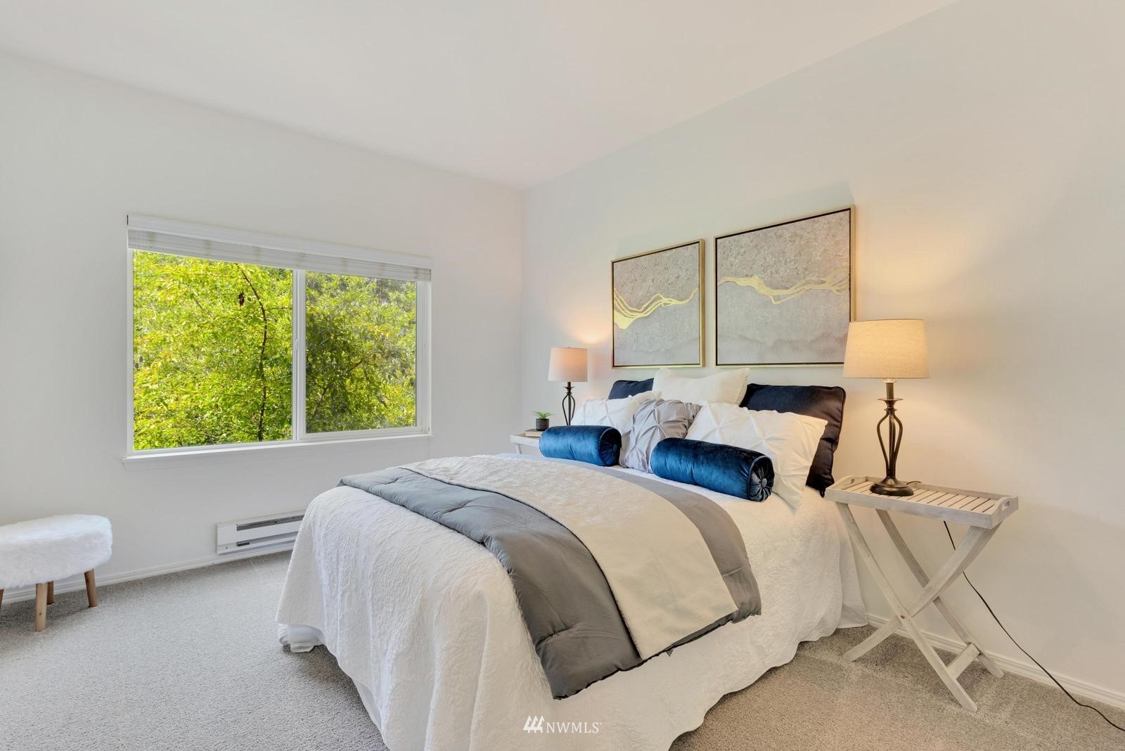 23908 Bothell Everett Highway, Unit D203 Bothell, WA 98021 - Photo 11 of 15 a bedroom with a bed and a window