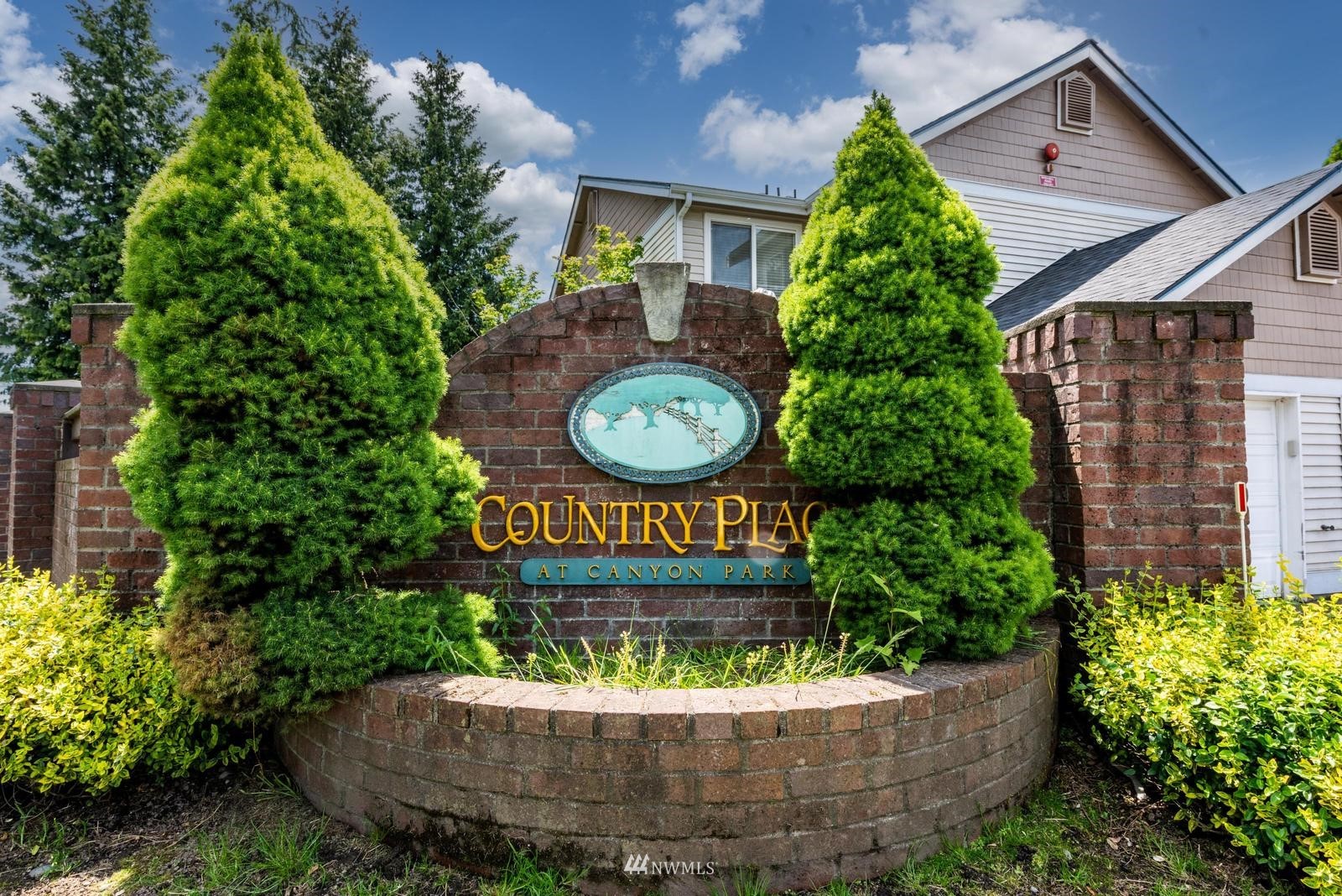 23908 Bothell Everett Highway, Unit D203 Bothell, WA 98021 - Photo 14 of 15 a view of a house with a garden and plants
