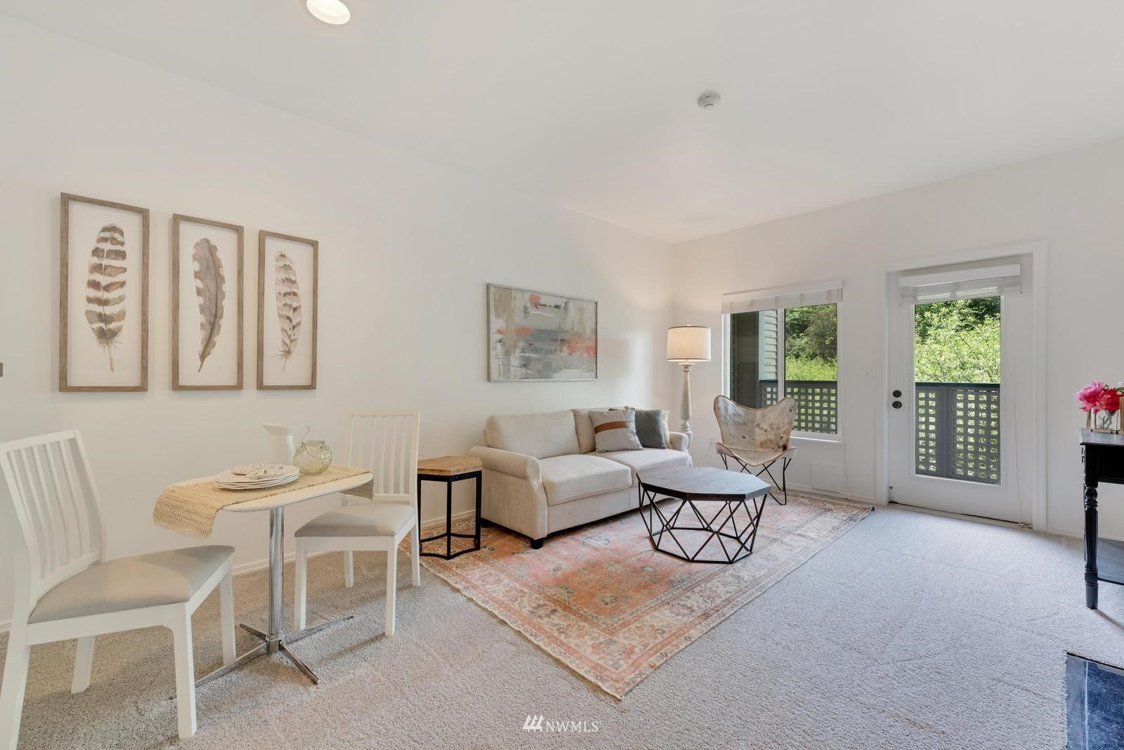 23908 Bothell Everett Highway, Unit D203 Bothell, WA 98021 - Photo 4 of 15 a living room with furniture and a window
