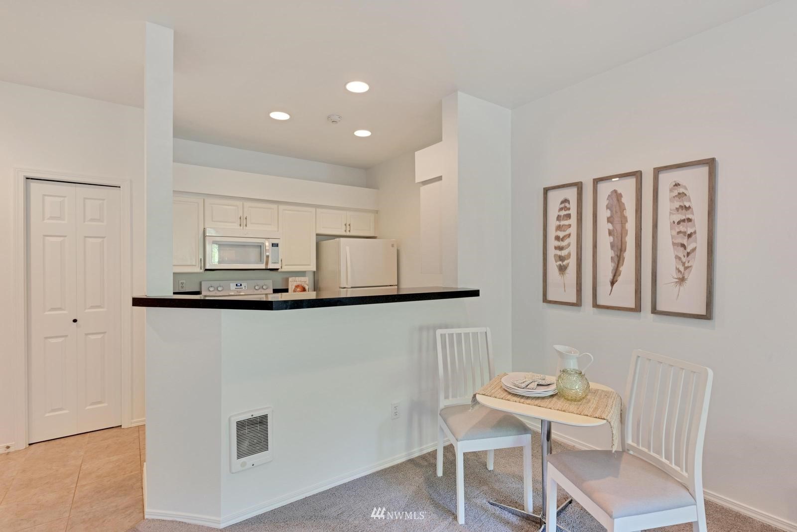 23908 Bothell Everett Highway, Unit D203 Bothell, WA 98021 - Photo 7 of 15 a view of kitchen with furniture and wooden floor