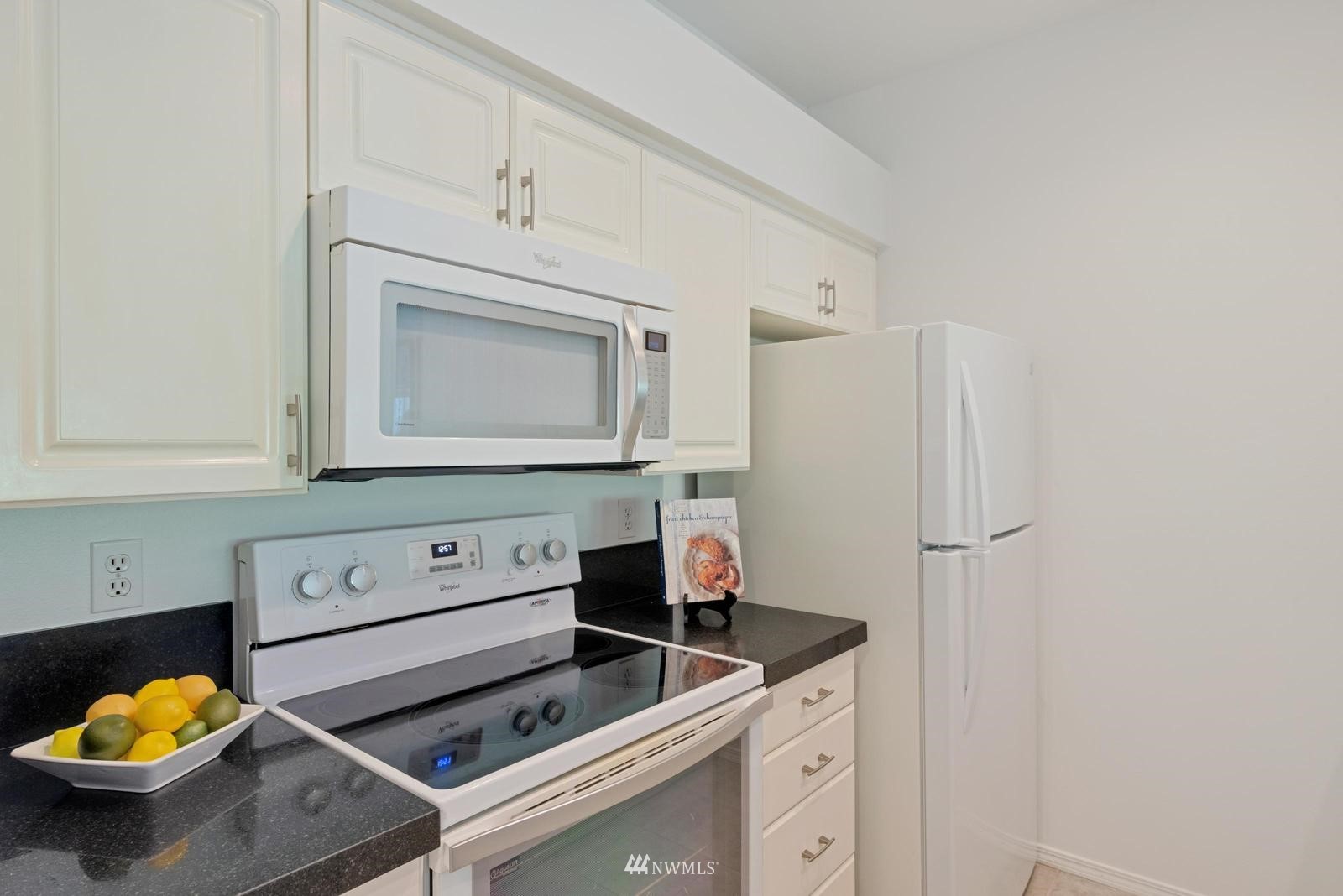 23908 Bothell Everett Highway, Unit D203 Bothell, WA 98021 - Photo 8 of 15 a kitchen with a sink cabinets and appliances