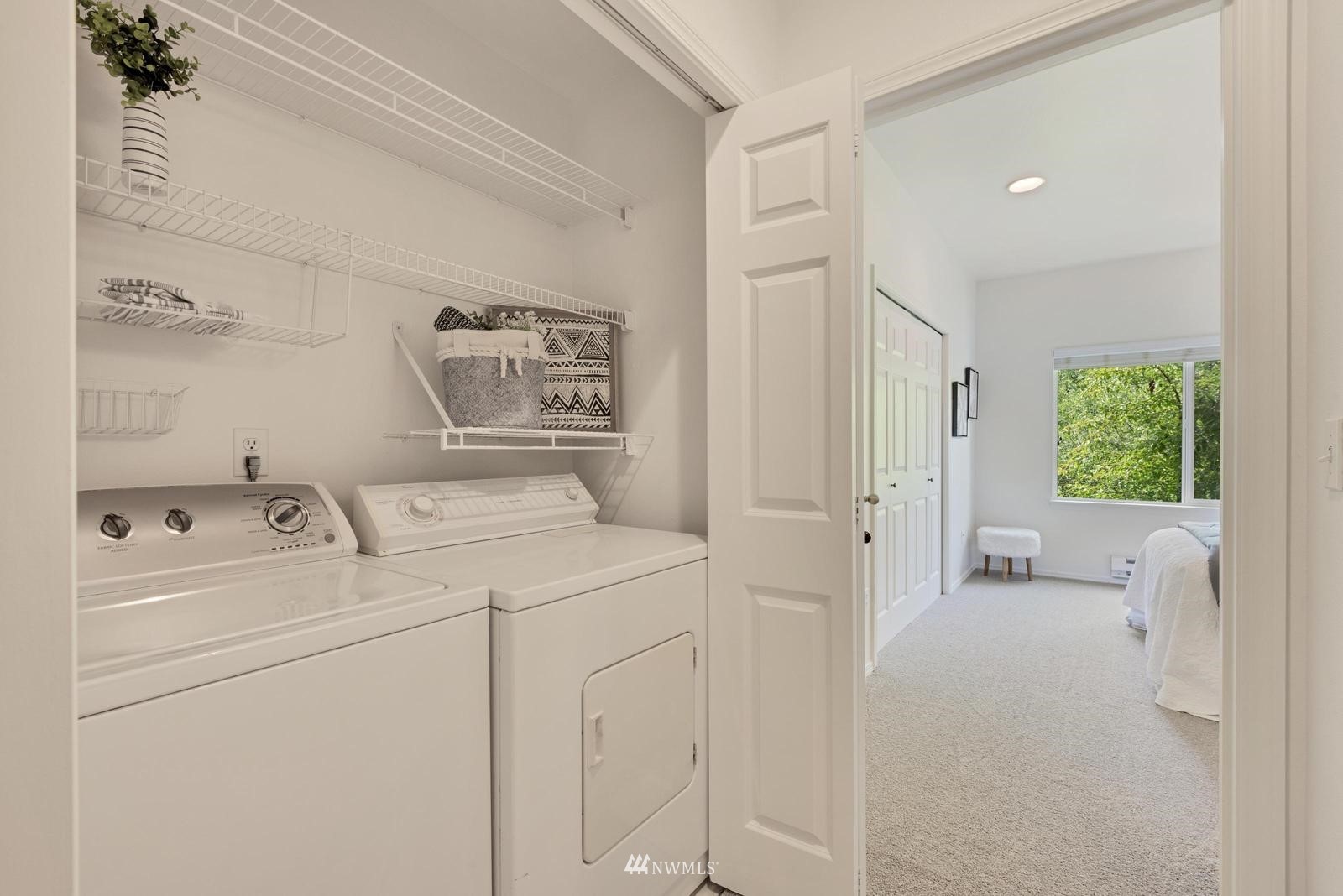23908 Bothell Everett Highway, Unit D203 Bothell, WA 98021 - Photo 10 of 15 a utility room with dryer and washer