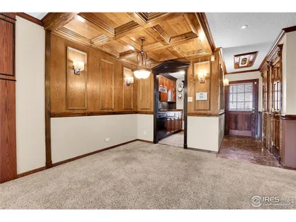 a kitchen with stainless steel appliances granite countertop a stove top oven a sink dishwasher and white cabinets