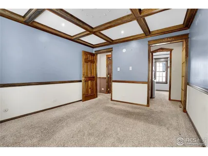 a view of walk in closet with wooden floor