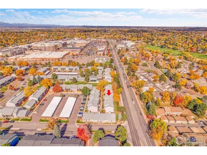 a picture of a bench in front of a wall