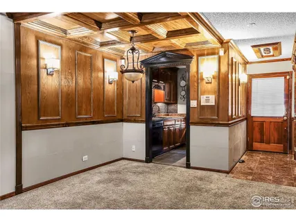 a view of livingroom with furniture and an empty room