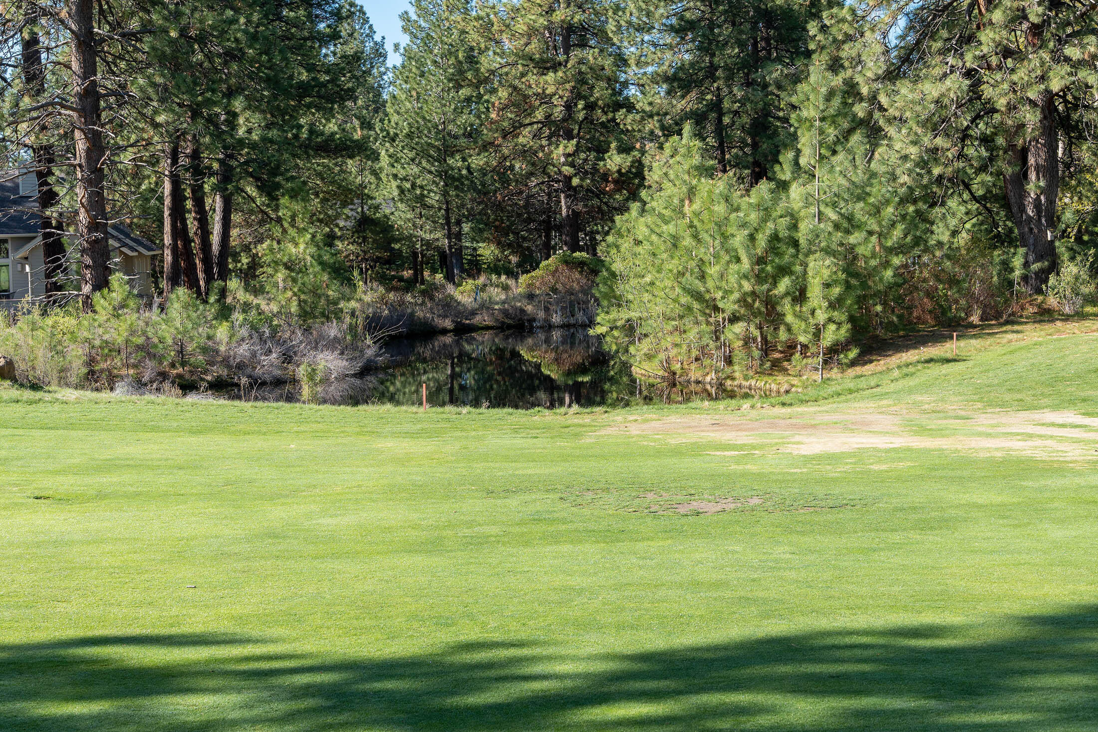 60711 Golf Village Loop Bend, OR 97702 - Photo 28 of 31 From 6th fairway into the lot behind the pond in center