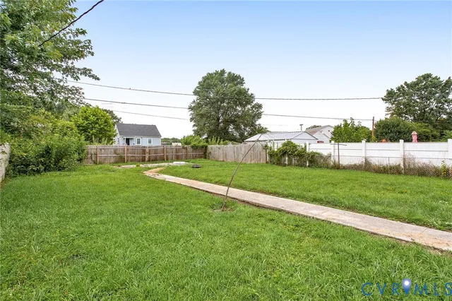 a front view of house with yard and outdoor seating