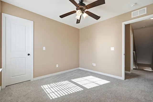 a view of an empty room and window
