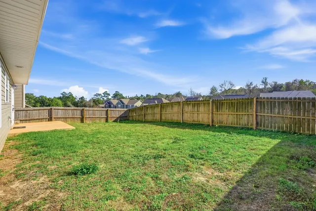 a view of a yard with a lake view