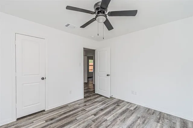 a view of room with hardwood floor