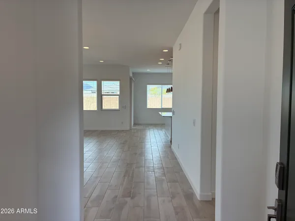 a view of hallway with wooden floor