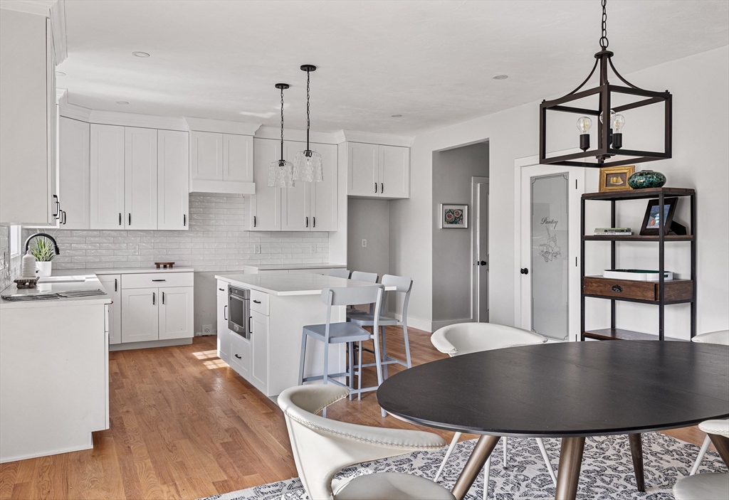 6 April Way Millis, MA 02054 - Photo 14 of 37 a kitchen with stainless steel appliances granite countertop a stove a sink and a refrigerator
