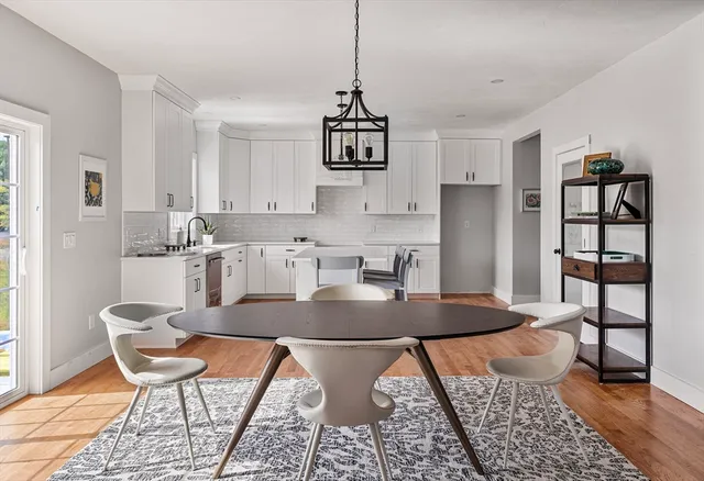 a workspace with furniture window and wooden floor
