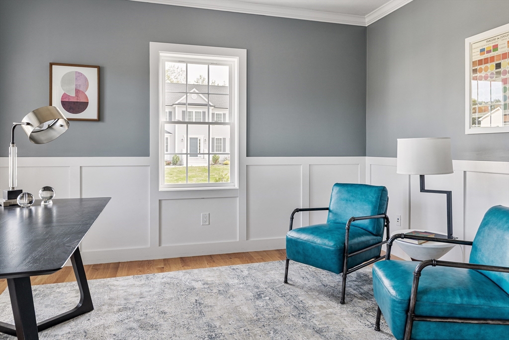 6 April Way Millis, MA 02054 - Photo 20 of 37 a living room with furniture and a window