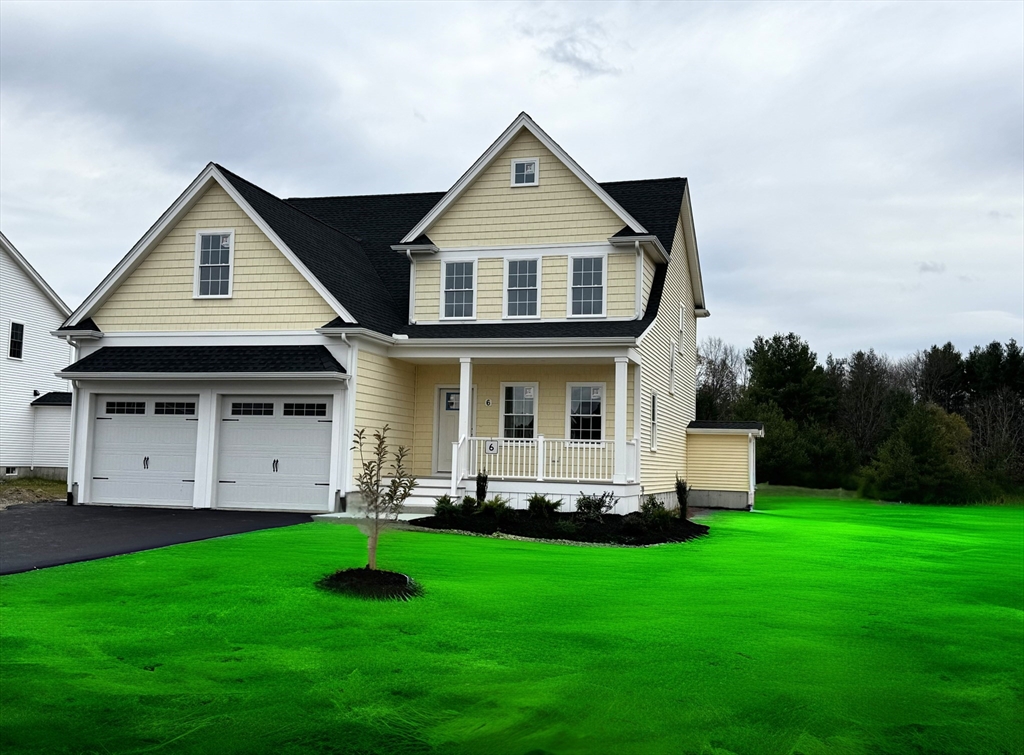 6 April Way Millis, MA 02054 - Photo 2 of 37 a front view of house with yard and green space