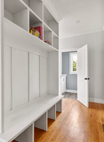 a view of kitchen and hall with wooden floor