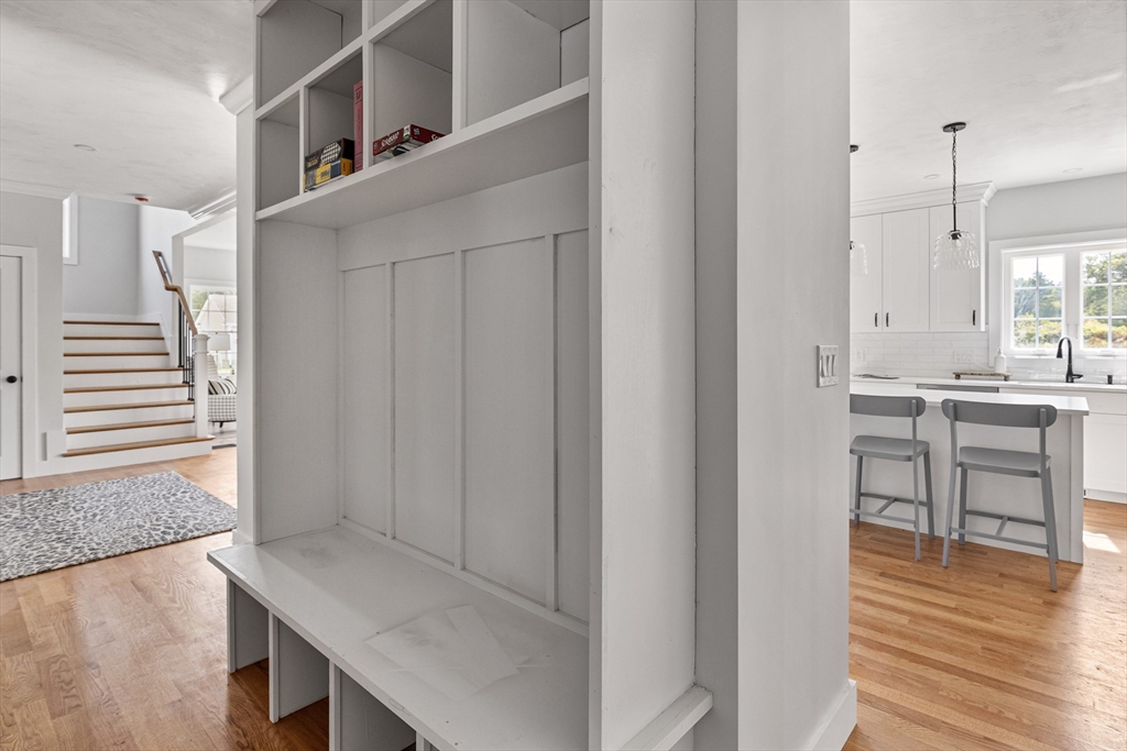6 April Way Millis, MA 02054 - Photo 22 of 37 a view of kitchen and hall with wooden floor