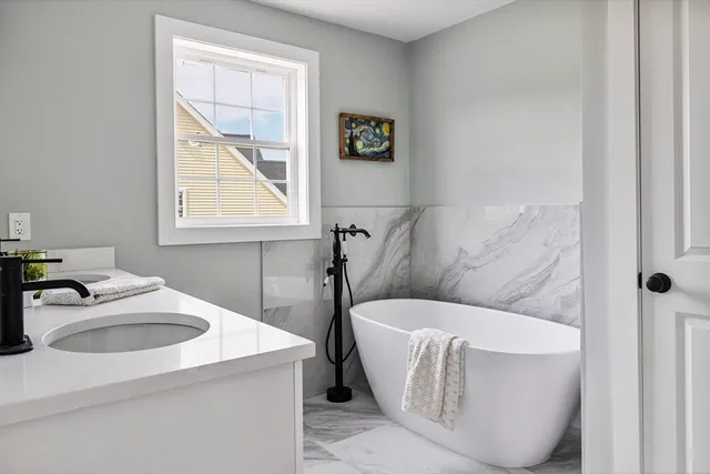 a bathroom with a glass shower door