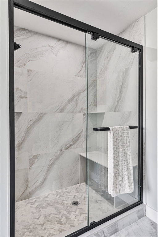 6 April Way Millis, MA 02054 - Photo 30 of 37 a bathroom with a glass shower door