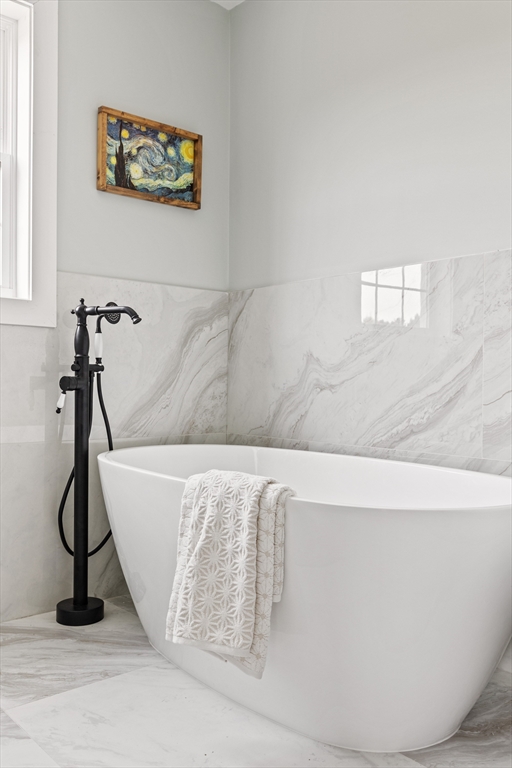 6 April Way Millis, MA 02054 - Photo 32 of 37 a living room with a couch