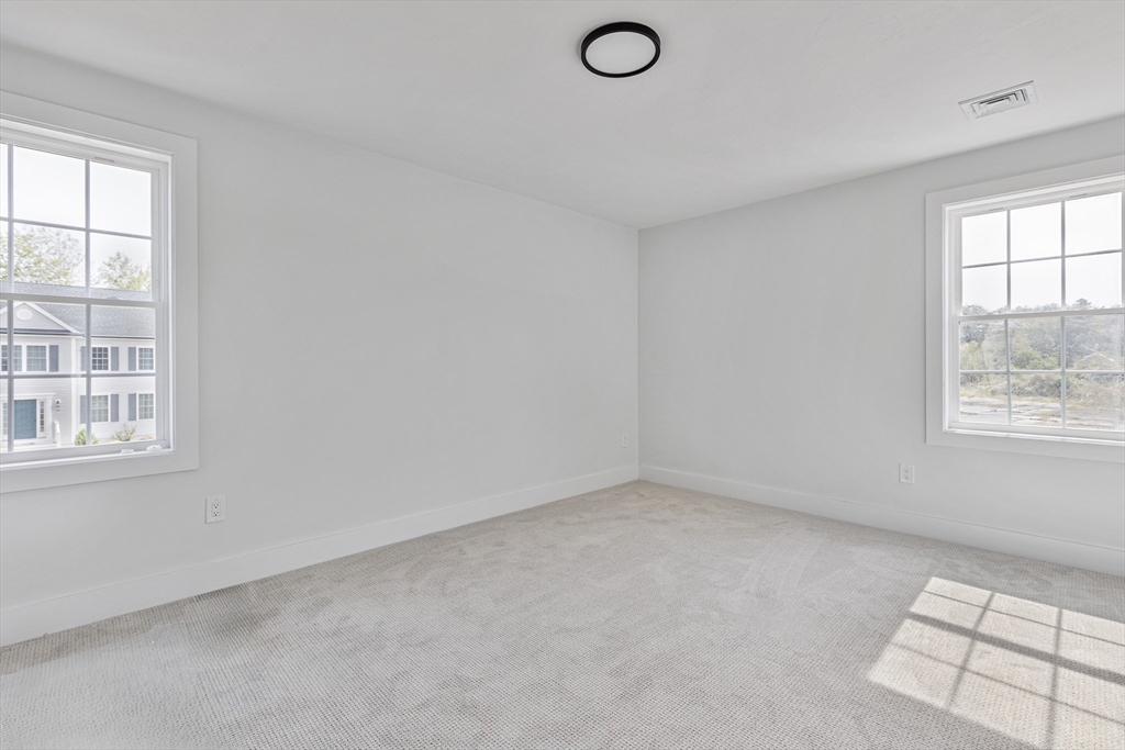 6 April Way Millis, MA 02054 - Photo 35 of 37 an empty room with windows