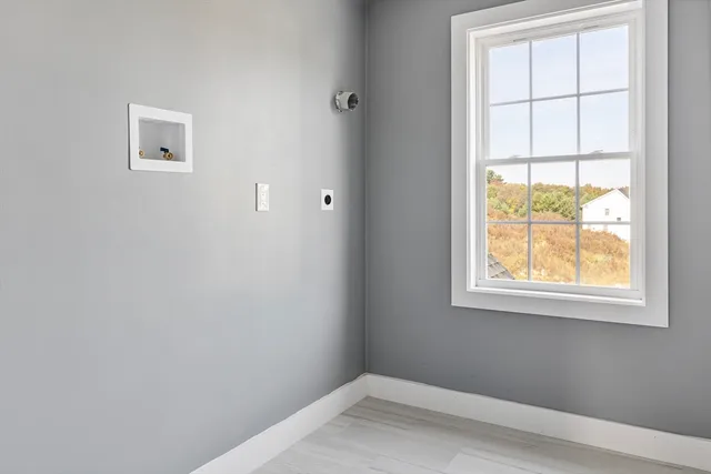 a bathroom with a sink toilet and window