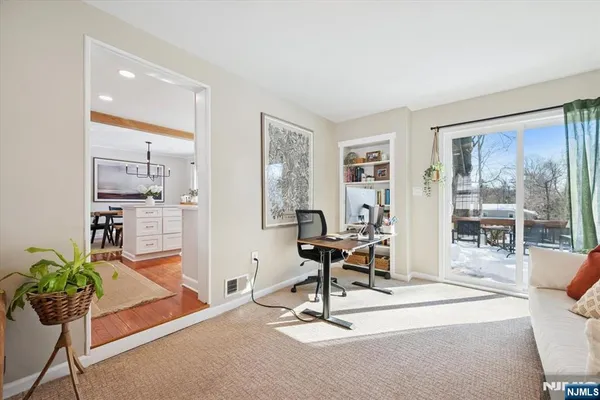 a view of a livingroom with furniture and a potted plant