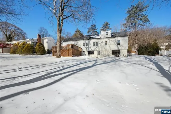 a view of a house with snow on the road