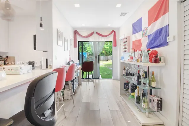 a white toilet sitting next to a shower curtain