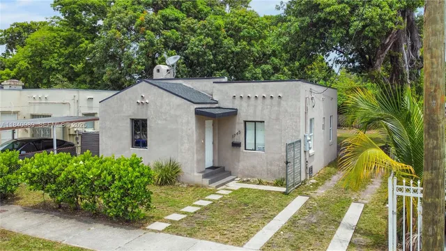 a aerial view of a house with a yard