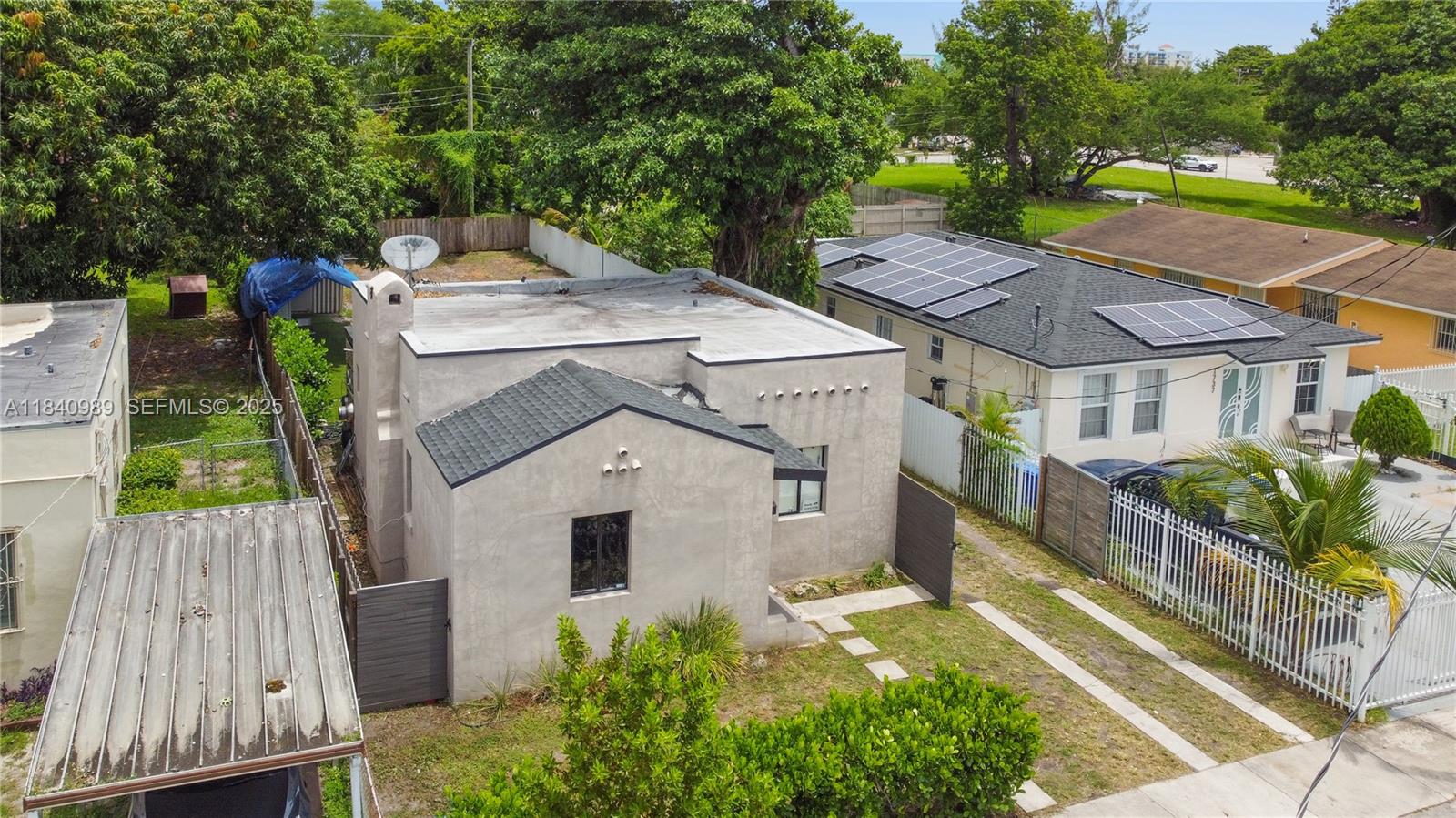 1745 Northwest 49th Street Miami, FL 33142 - Photo 26 of 30 a aerial view of a house with a yard