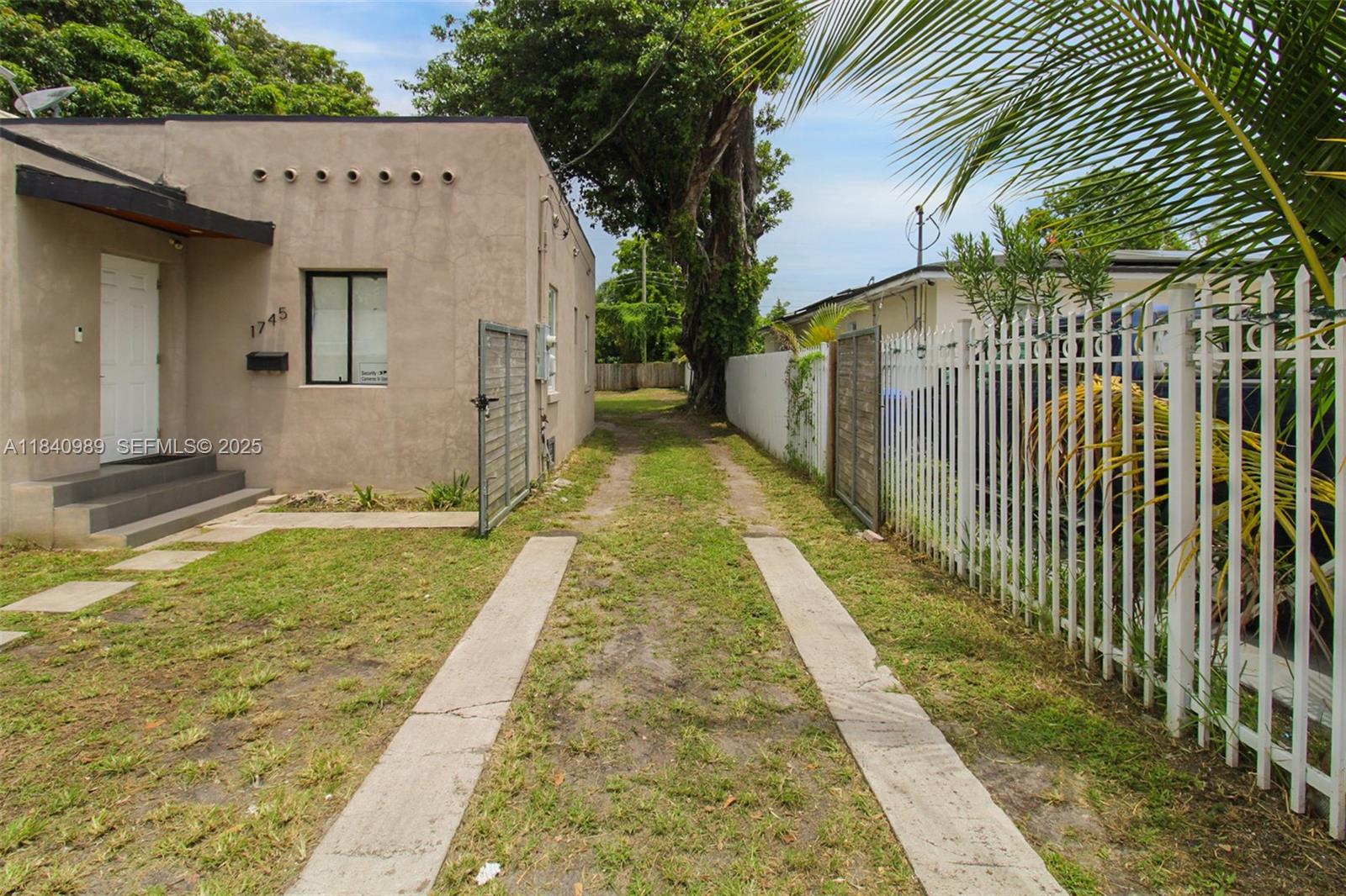 1745 Northwest 49th Street Miami, FL 33142 - Photo 3 of 30 a view of a house with backyard