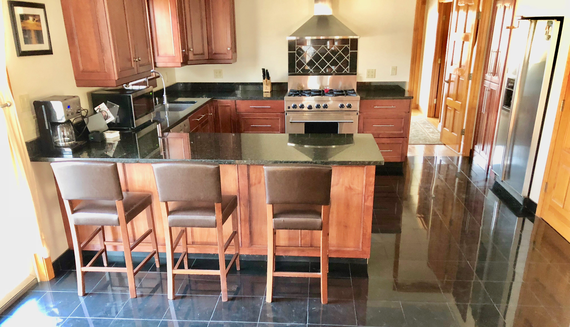 375 West Tisbury Road Edgartown, MA 02539 - Photo 13 of 32 a kitchen with a table and chairs in it