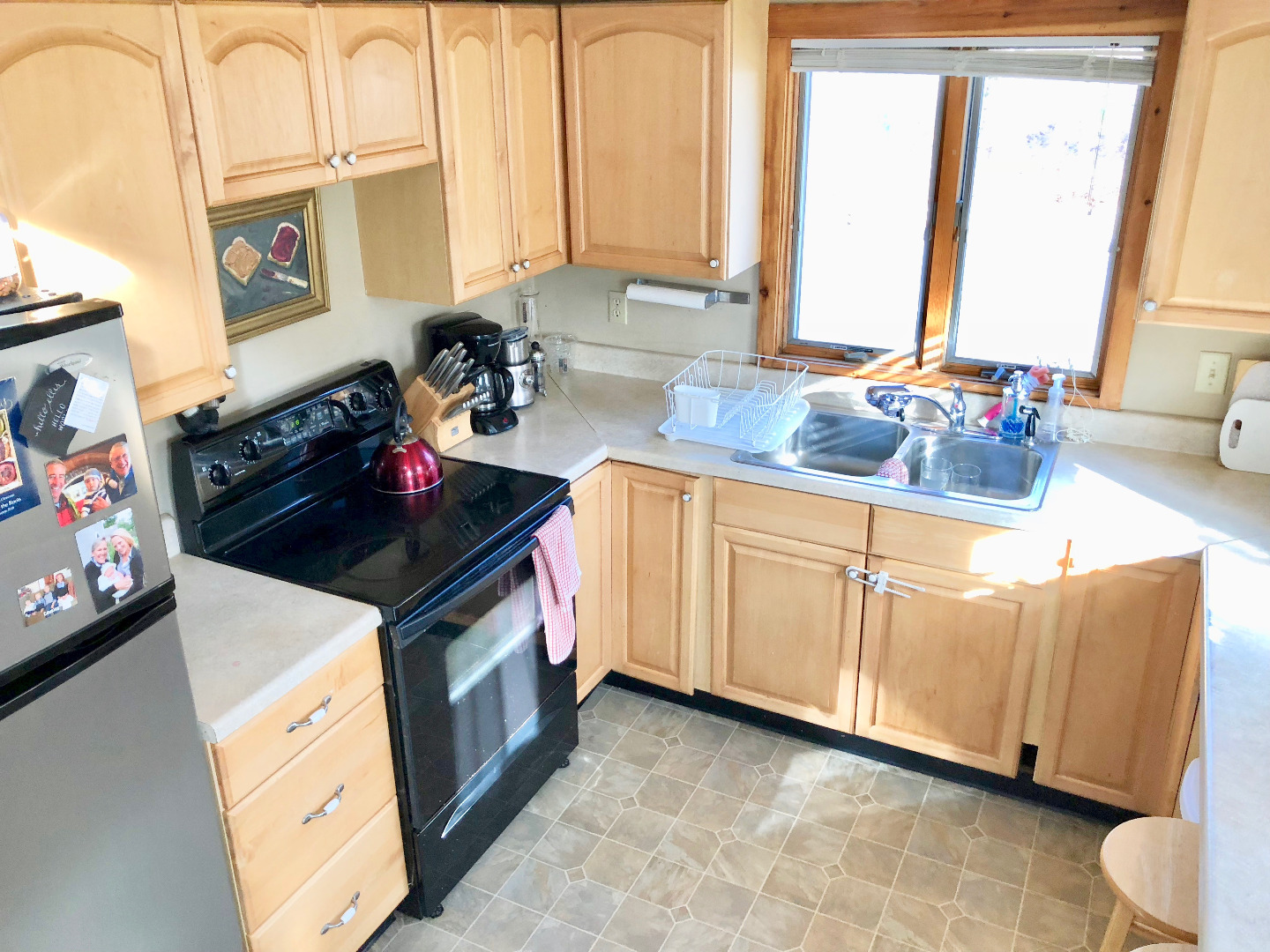 375 West Tisbury Road Edgartown, MA 02539 - Photo 31 of 32 a kitchen with stainless steel appliances a sink a stove and a microwave