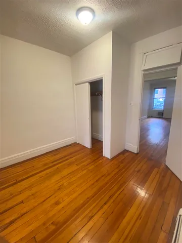 a bathroom with a bathtub shower sink vanity and toilet