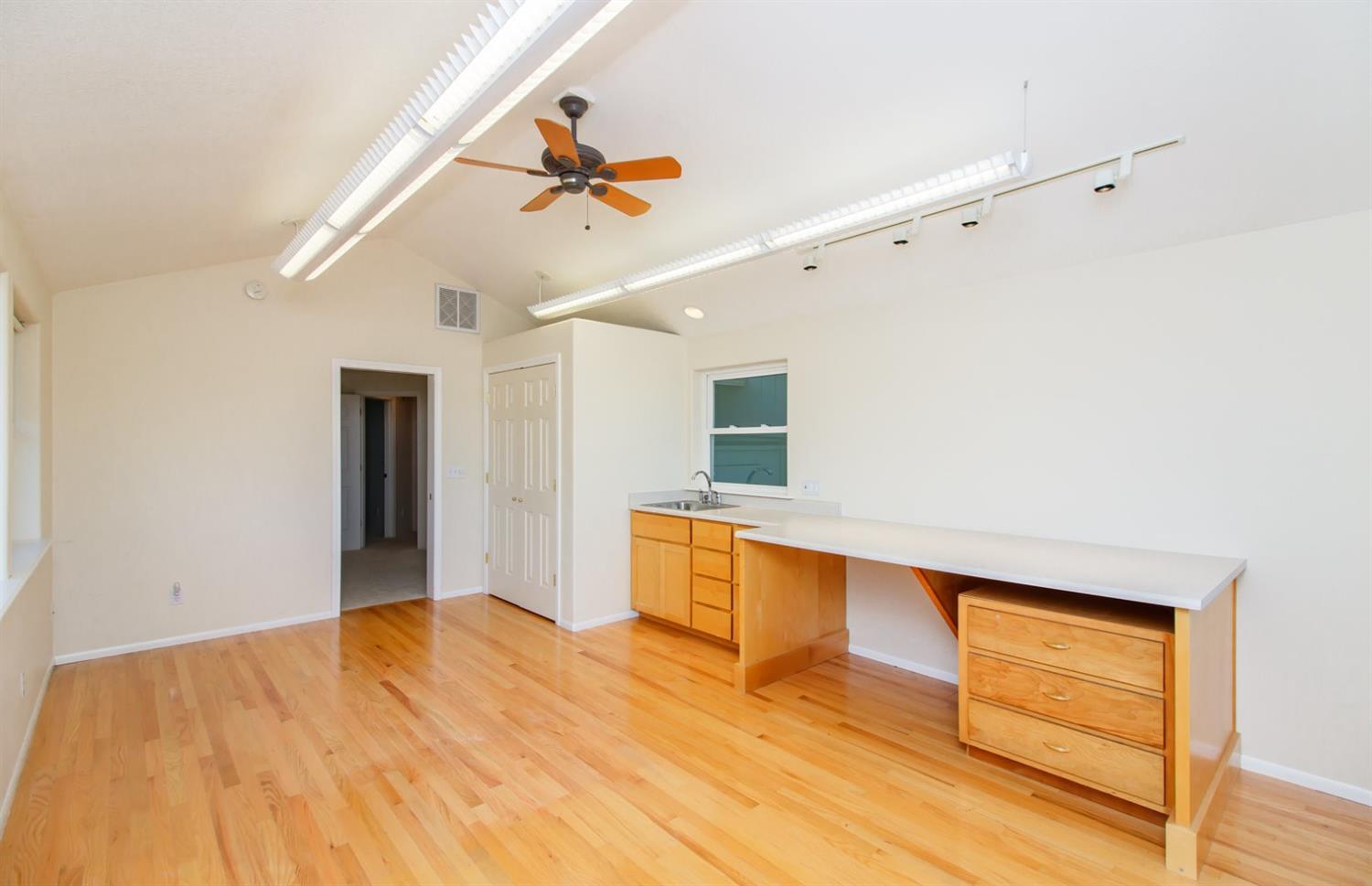 181 Autumn Ridge Road Talent, OR 97540 - Photo 18 of 25 a view of a room with wooden floor and a ceiling fan