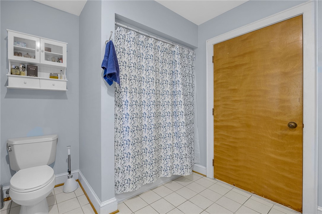 218 Northridge Drive Anderson, SC 29621 - Photo 34 of 50 A well-maintained bathroom with bright tile flooring and a functional shower area.