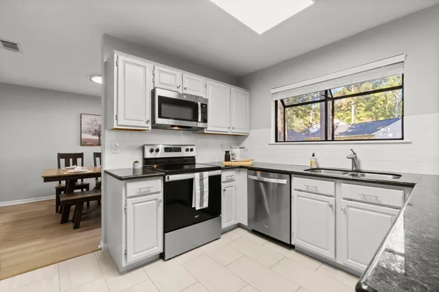 a living room with furniture fireplace and flat screen tv