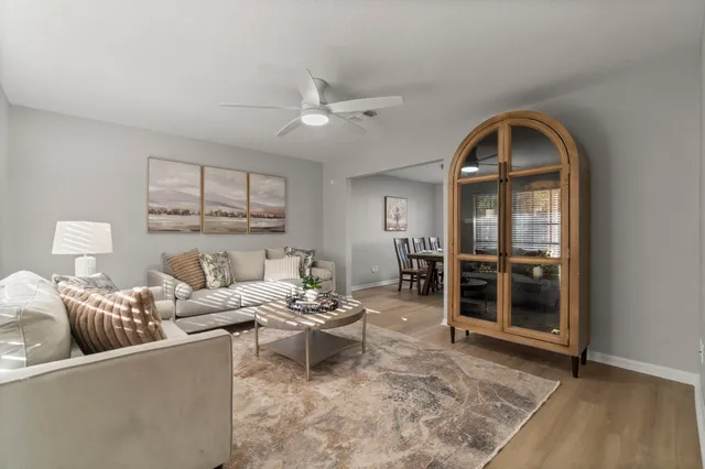 a kitchen with stainless steel appliances granite countertop a refrigerator sink and stove