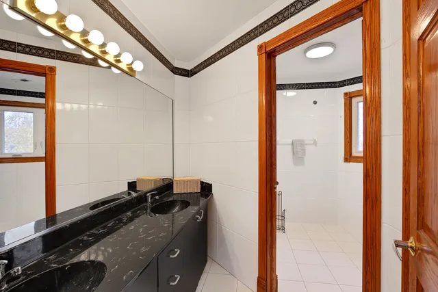 a kitchen with a refrigerator and a stove