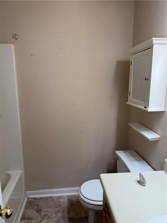 250 Countryside Lane Covington, GA 30016 - Photo 14 of 19 a white toilet sitting next to a white sink