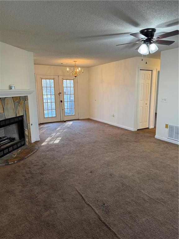 250 Countryside Lane Covington, GA 30016 - Photo 7 of 19 a view of an empty room with a fireplace and a chandelier fan