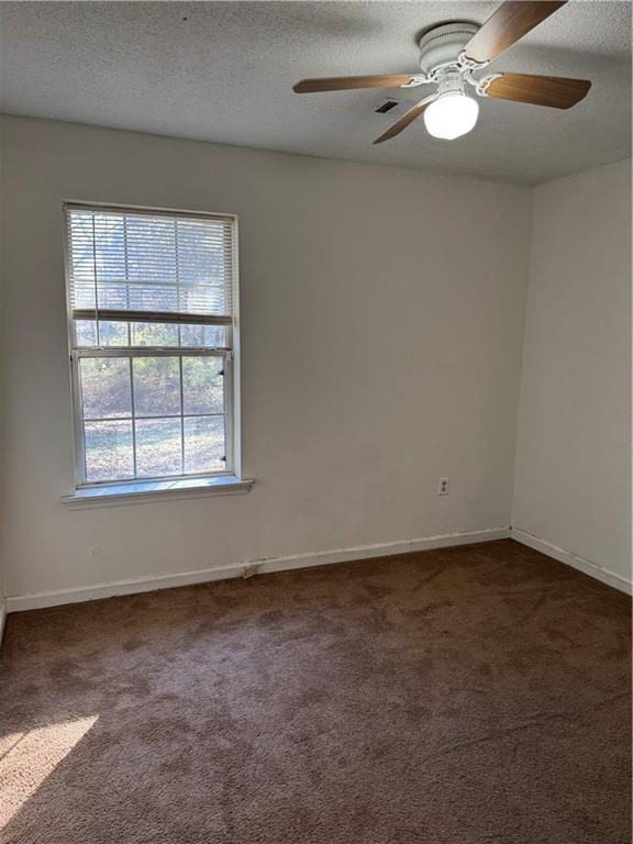 250 Countryside Lane Covington, GA 30016 - Photo 10 of 19 an empty room with a window