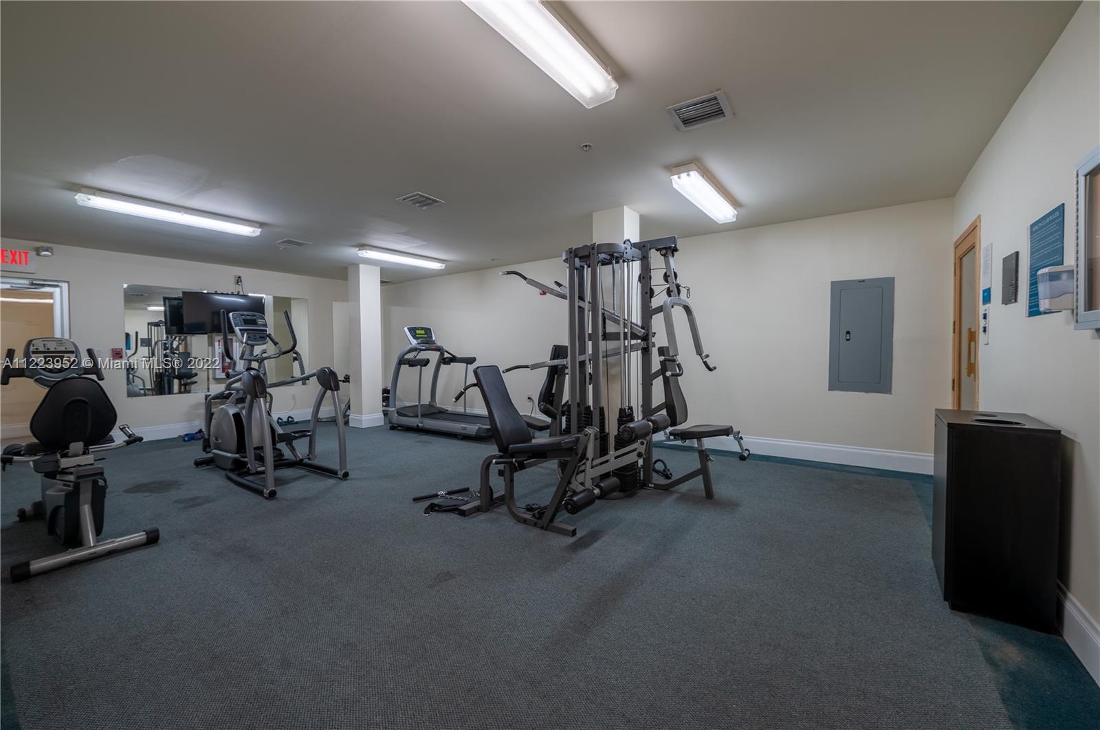 3339 Virginia Street, Unit 339 Miami, FL 33133 - Photo 12 of 13 a view of a room with gym equipment