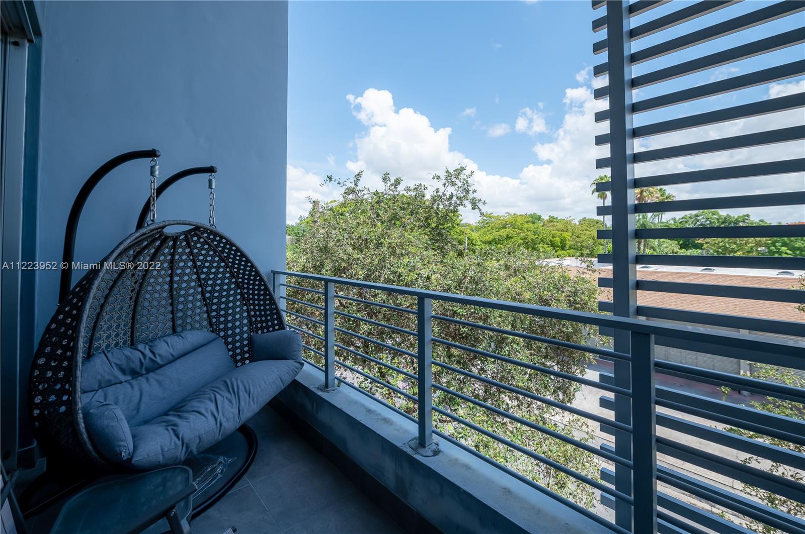 3339 Virginia Street, Unit 339 Miami, FL 33133 - Photo 6 of 13 a view of a balcony with chairs