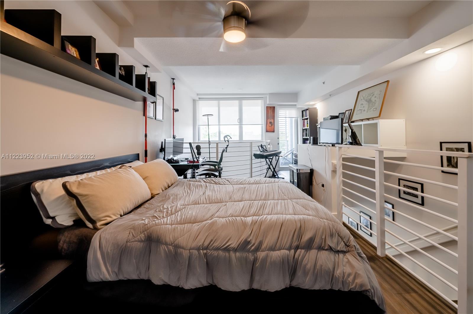 3339 Virginia Street, Unit 339 Miami, FL 33133 - Photo 9 of 13 a bedroom with a bed and window
