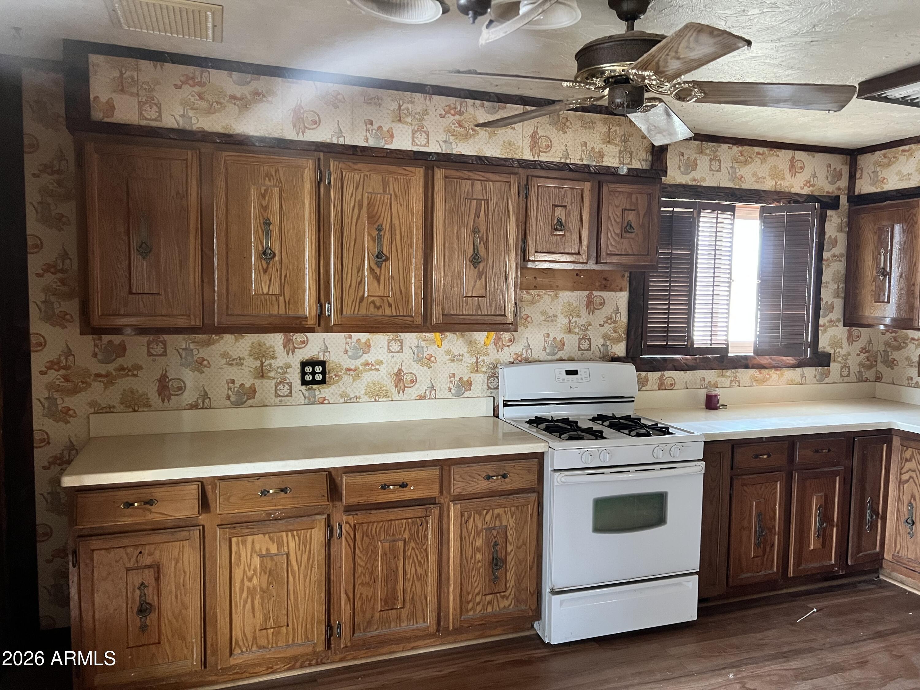 315 Fairhaven Road Kearny, AZ 85137 - Photo 6 of 9 a kitchen with stainless steel appliances granite countertop a stove and a sink
